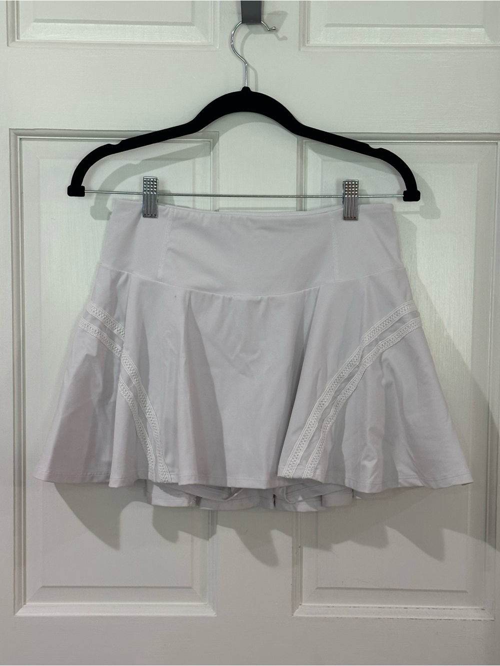 White tennis skirt with built in shorts and pockets.